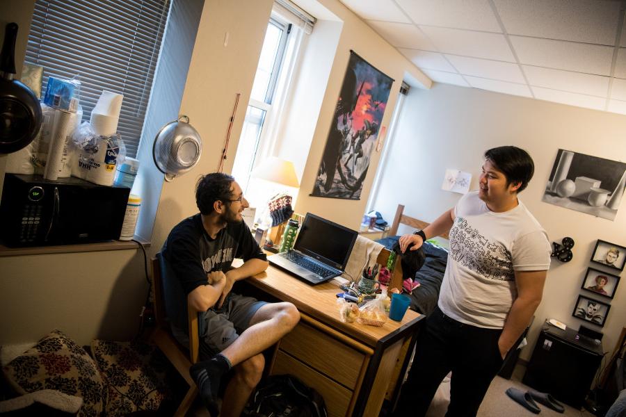 Beloit students in a dorm room on the Beloit College campus.